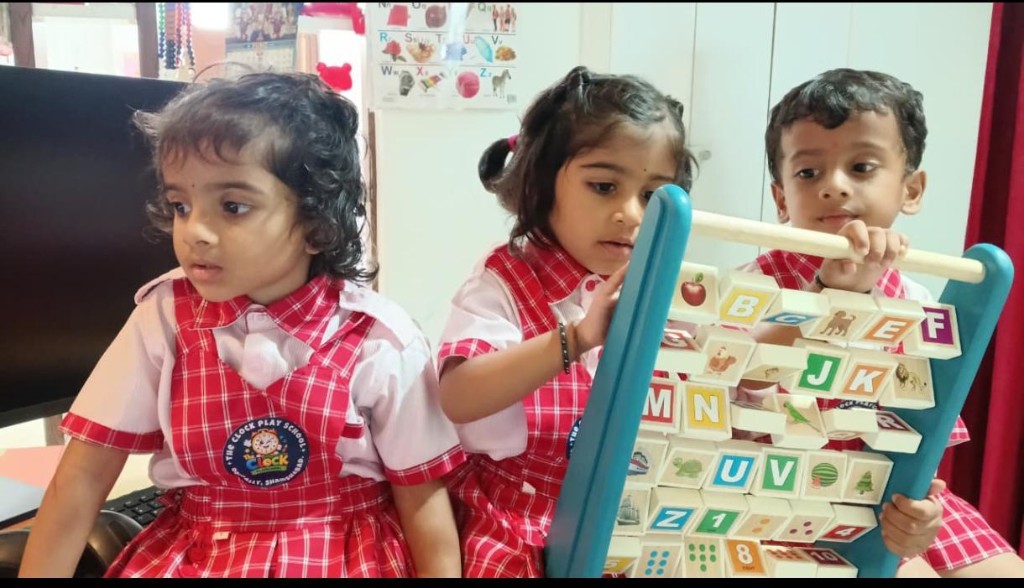 Children learning with alphabet toy