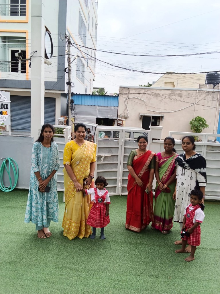 Staff and students outdoors at school